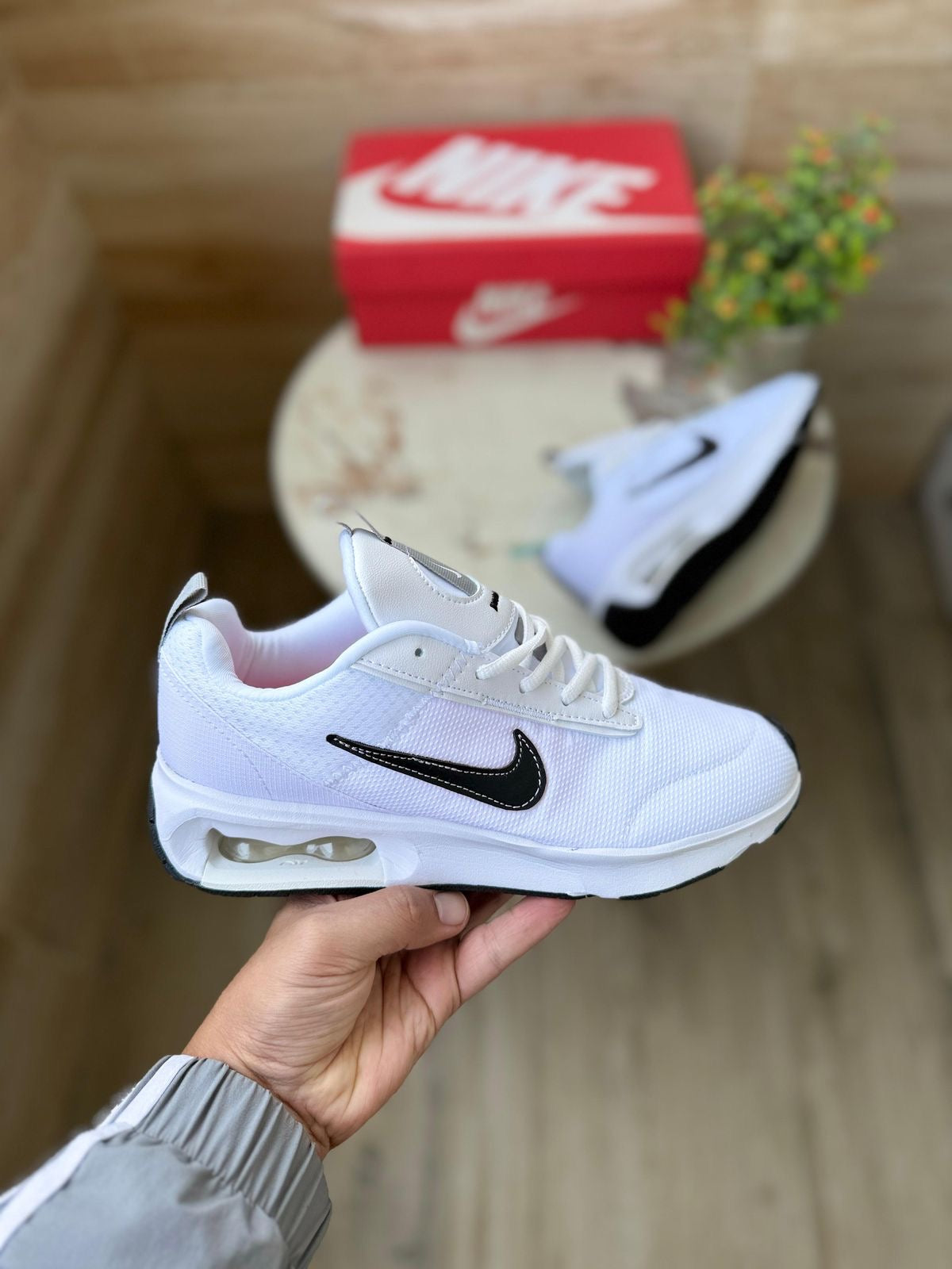 Stylish NIKE AIRMAX INTRLK ELITE shoes in white, showcasing showroom quality and comfort, perfect for your sneaker collection.